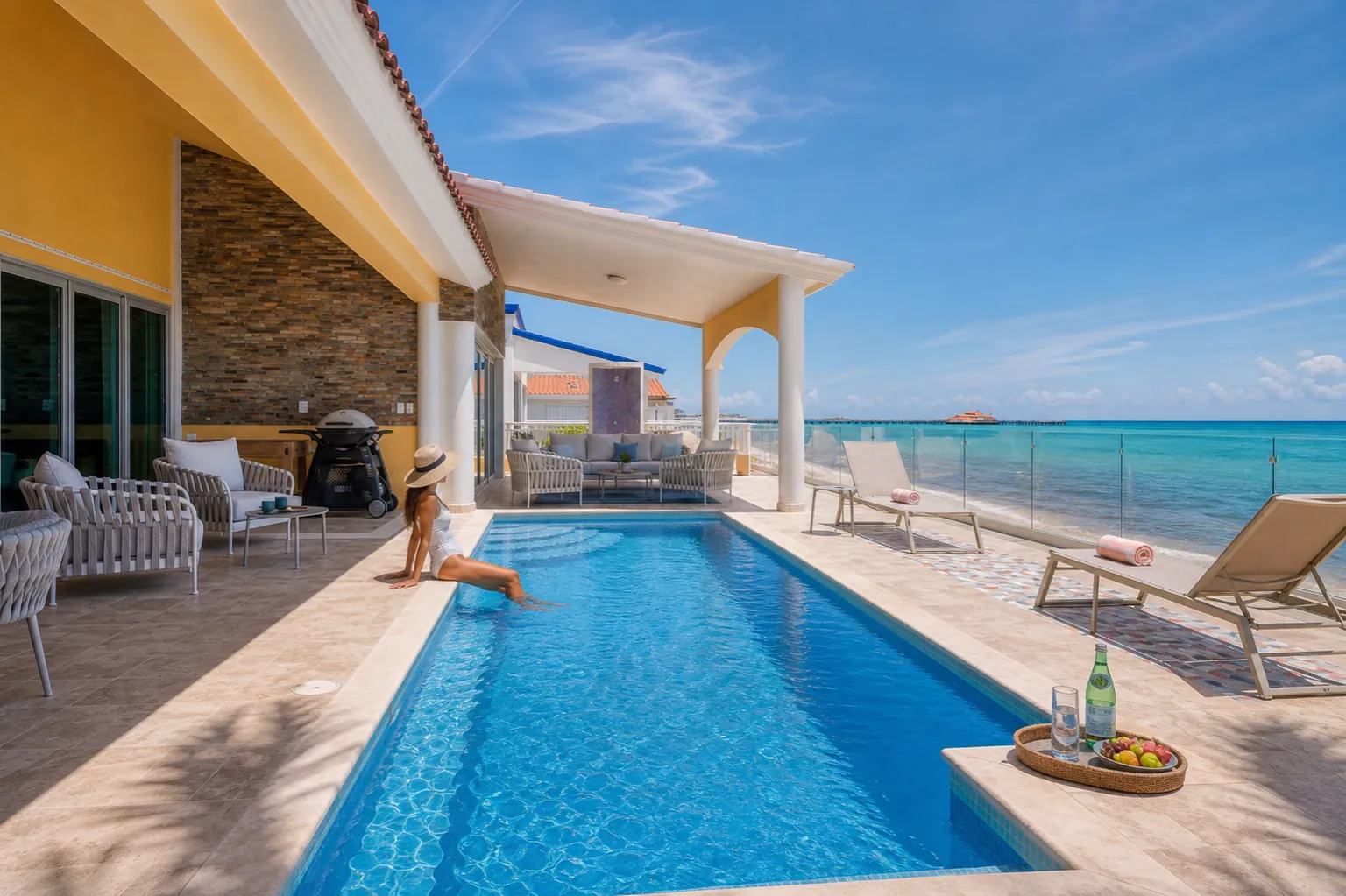 Private pool on the Casa Karma terrace with loungers and the turquoise Caribbean just beyond